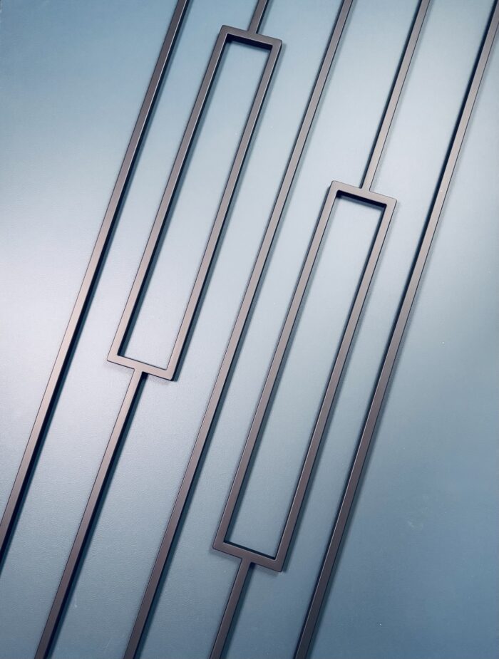 black rectangle and square metal spindles