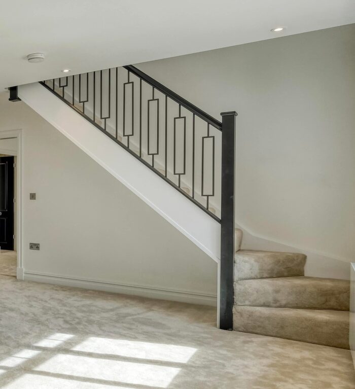 black metal spindles with black handrail baserail and newel post