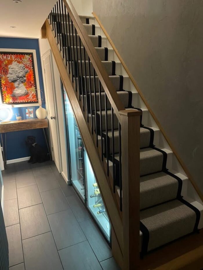 Oak staircase with black metal spindles