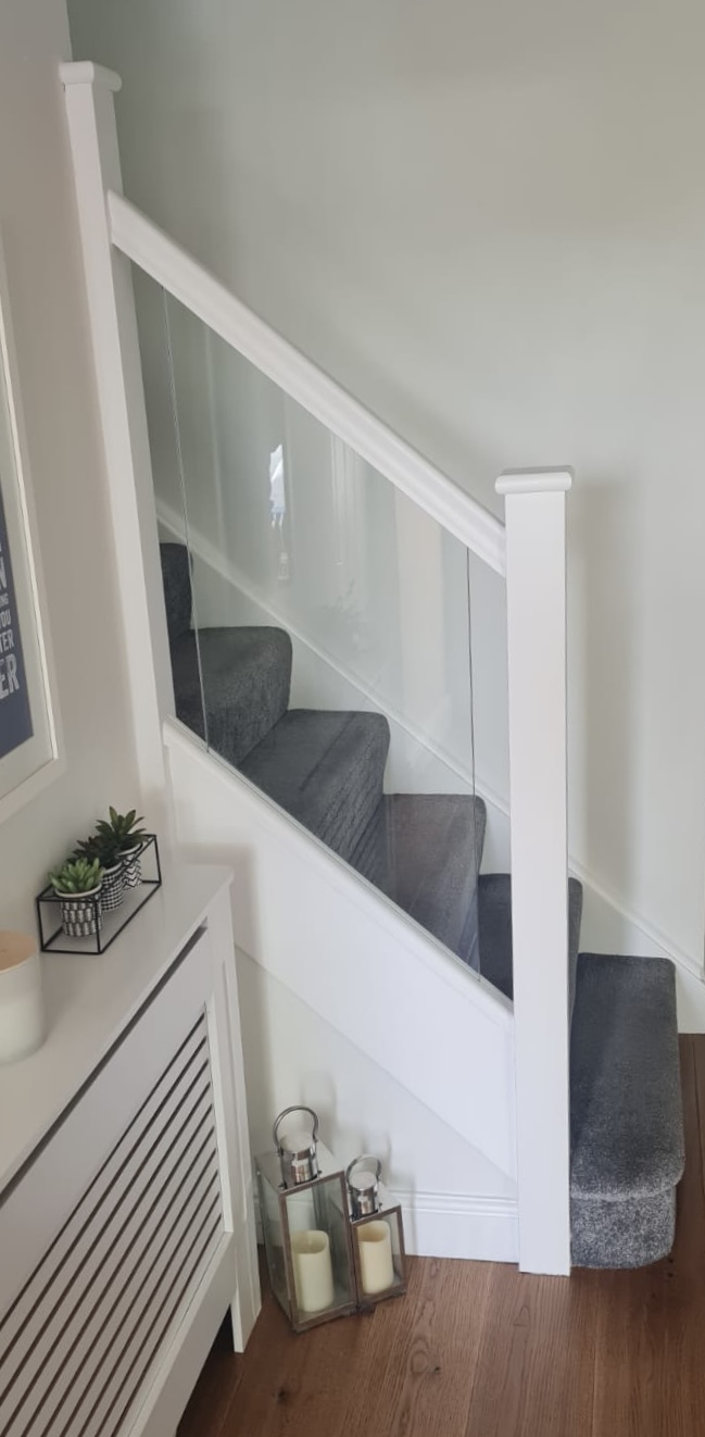 White stair parts with glass panels